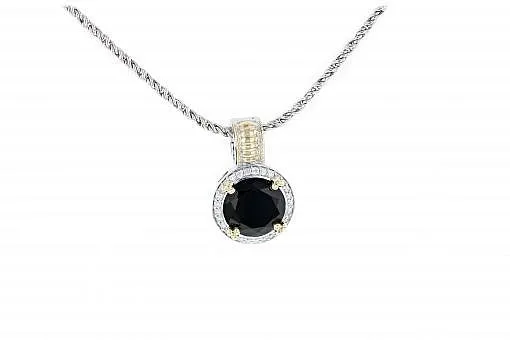 Italian sterling silver pendant with black onyx center stone, 0.38ct white diamonds and solid 14K yellow gold accents.  The chain is included